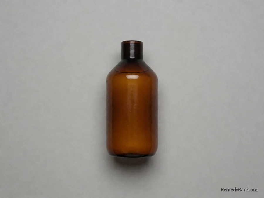 A plain industrial amber bottle of clear DMSO liquid, photographed plainly on a neutral grey background.