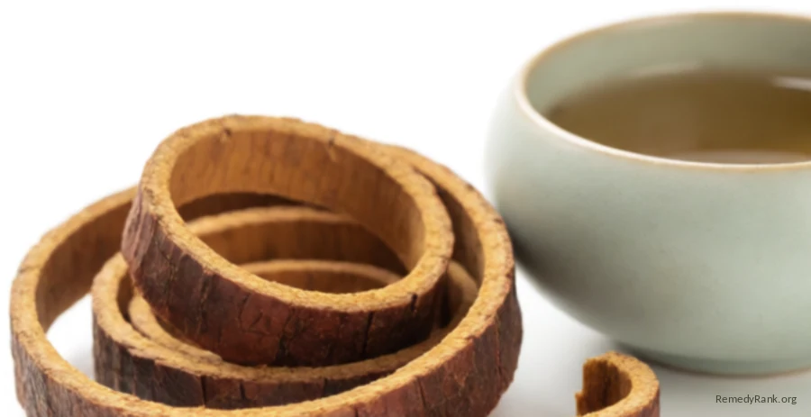 Curled strips of reddish-brown pau d'arco inner bark beside a ceramic teacup.